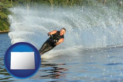 colorado map icon and a young man waterskiing on a lake