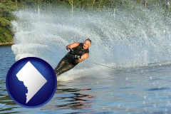 washington-dc a young man waterskiing on a lake