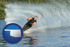 oklahoma map icon and a young man waterskiing on a lake
