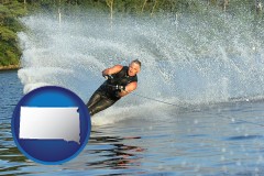 south-dakota a young man waterskiing on a lake