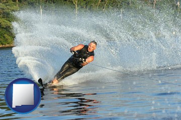 a young man waterskiing on a lake - with New Mexico icon