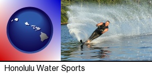 Honolulu, Hawaii - a young man waterskiing on a lake