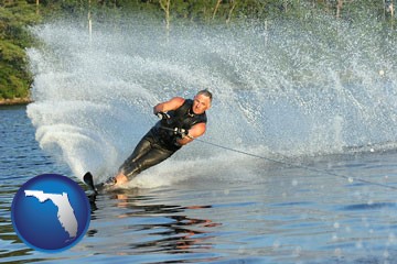 a young man waterskiing on a lake - with Florida icon